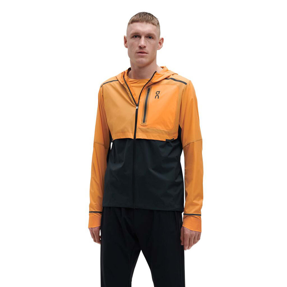 Front model view of men's on weather jacket in orange (7518271242402)