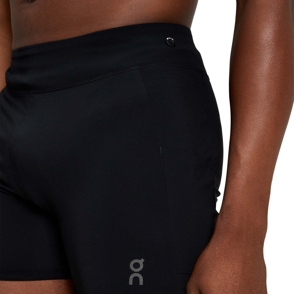 Close-up view of a model wearing the inner liner short from a pair of men's On Hybrid Shorts in the ivy colour (7763890536610)