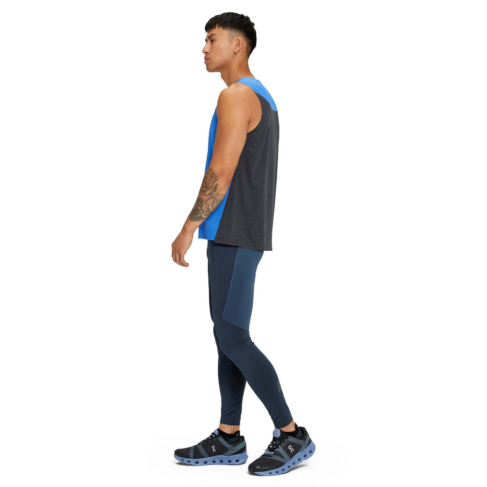 A model wearing a pair of men's On Performance Tights in the Navy and Denim colour (7763897155746)