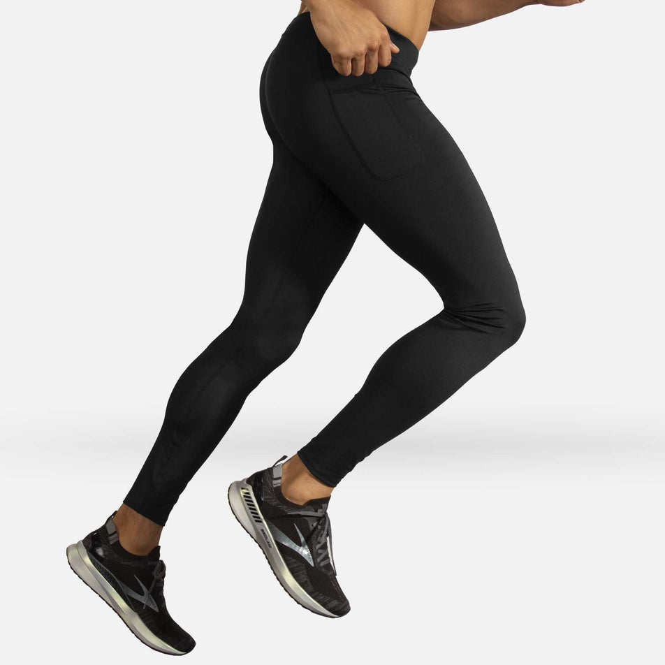 A model wearing the men's Brooks Source Tight in a running stance (6935063986338)