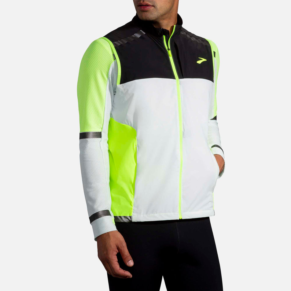 Front Pocket Use View of Men's Brooks Carbonite Vest (6913727594658)