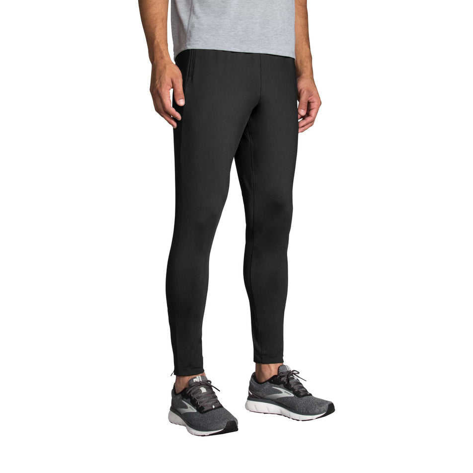 Front view of a model wearing a pair of Brooks Men's Spartan Running Pants (7778528526498)