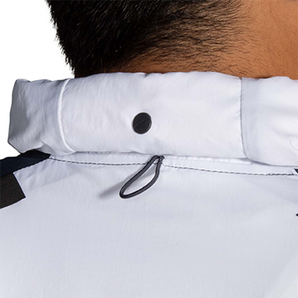 Roll away hood view of Brooks Men's Run Visible Convertible Jacket in white (7599102328994)