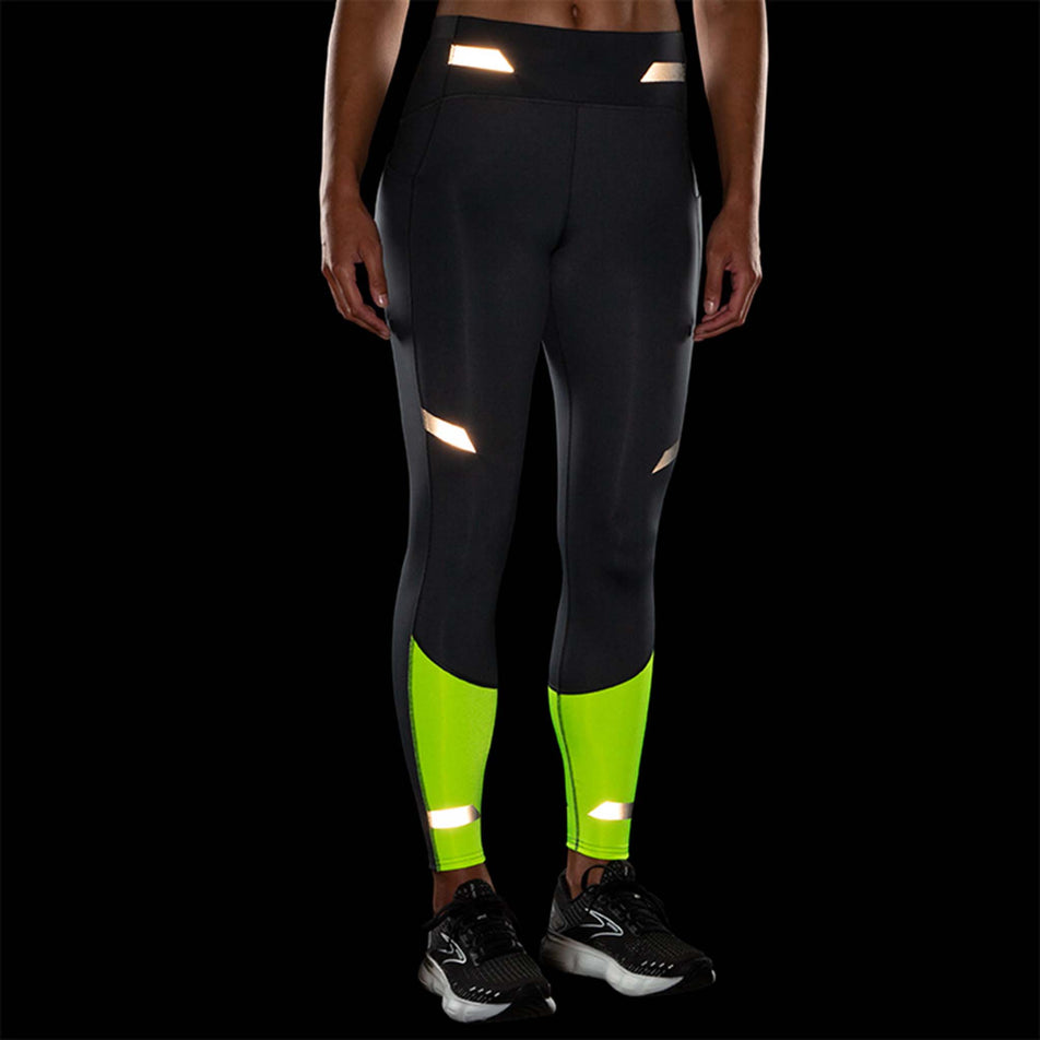 Front reflective view of Brooks Women's Run Visible Tight in black (7599101509794)