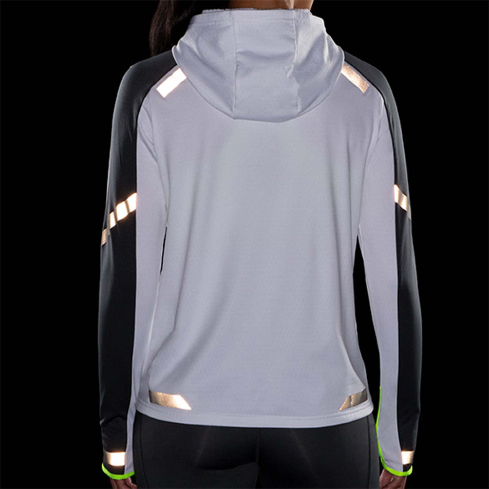 Back reflective view of Brooks Women's Run Visible Thermal Hoodie in white (7599100625058)