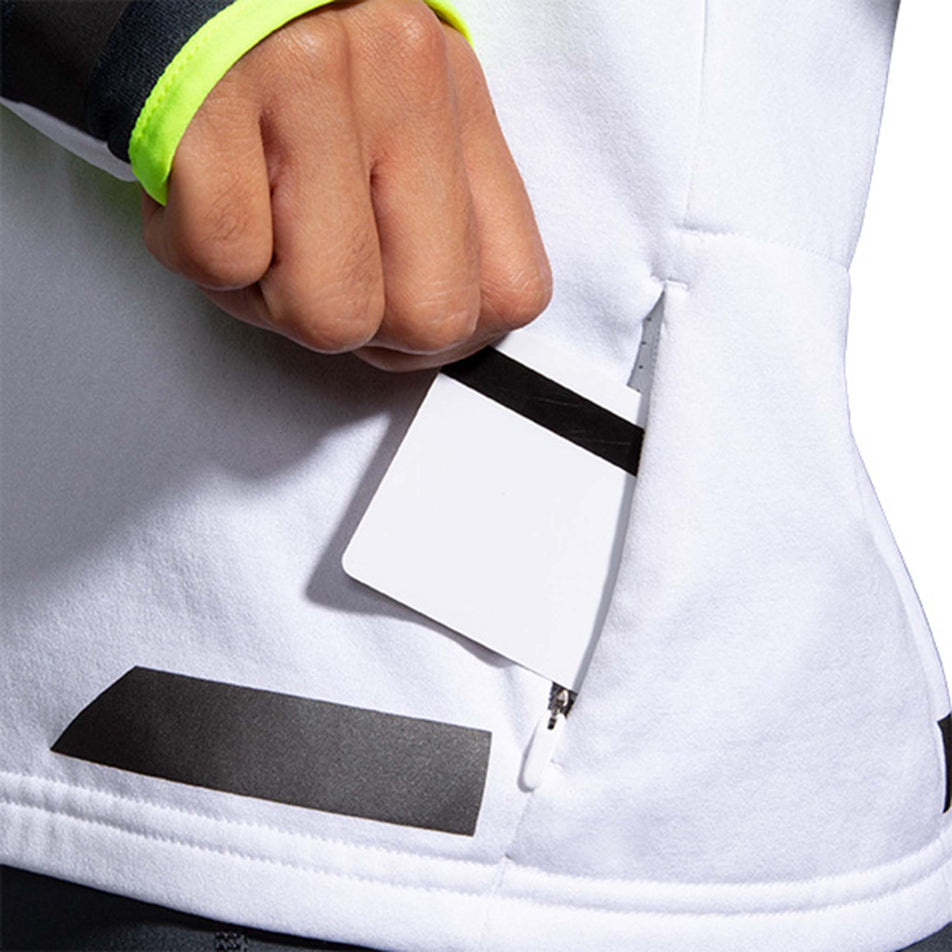Secure pocket view of Brooks Women's Run Visible Thermal Hoodie in white (7599100625058)