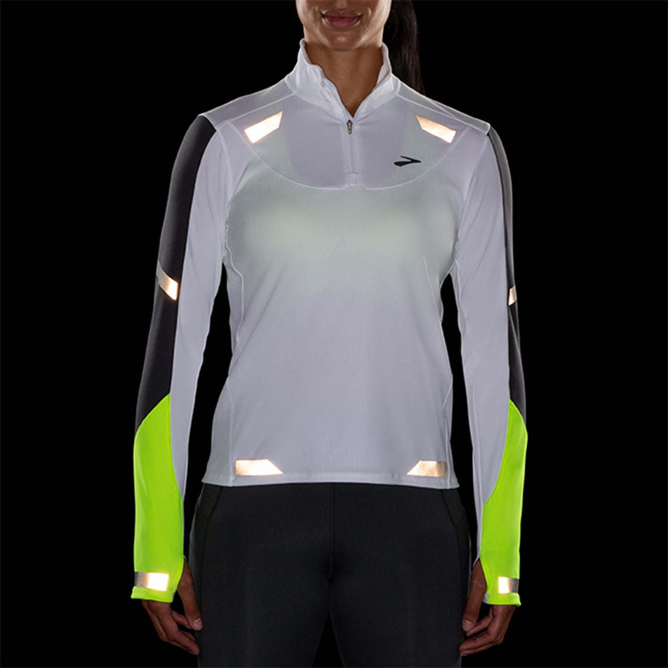 Reflective front view of Brooks Women's Run Visible 1/2 Zip in white (7596658196642)