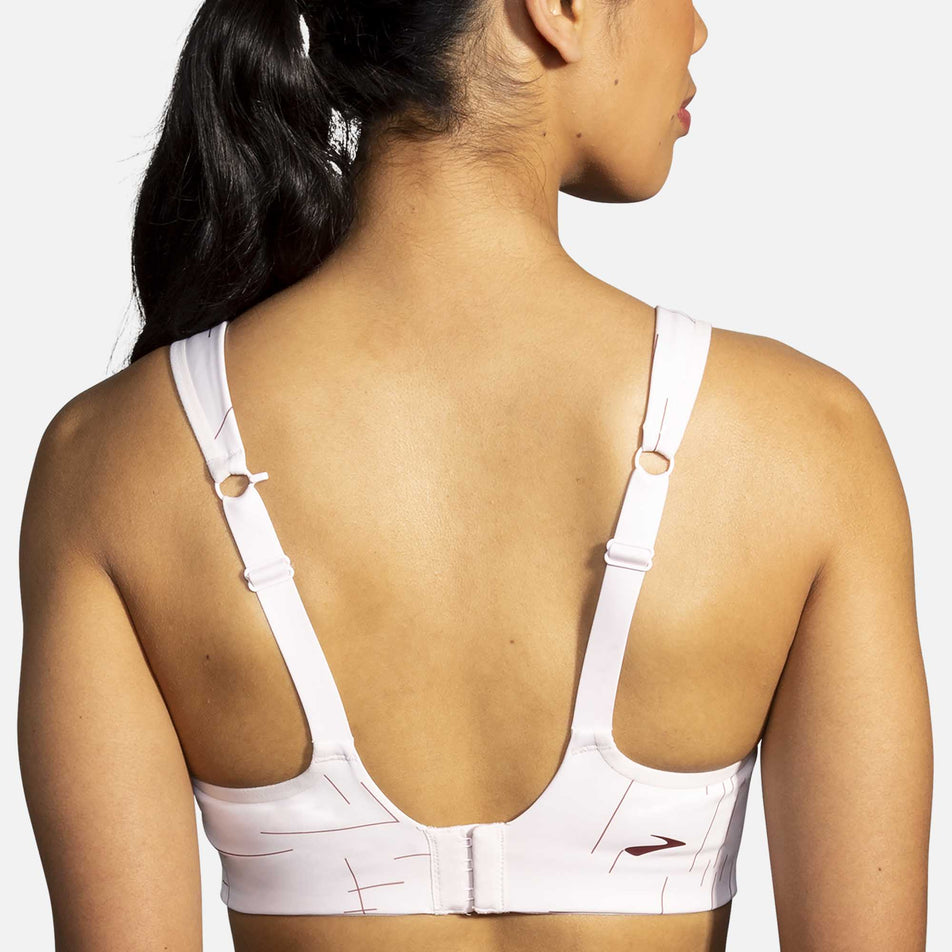 The back of a model who is wearing the women's Brooks Drive Convertable Run Bra (6935121887394)