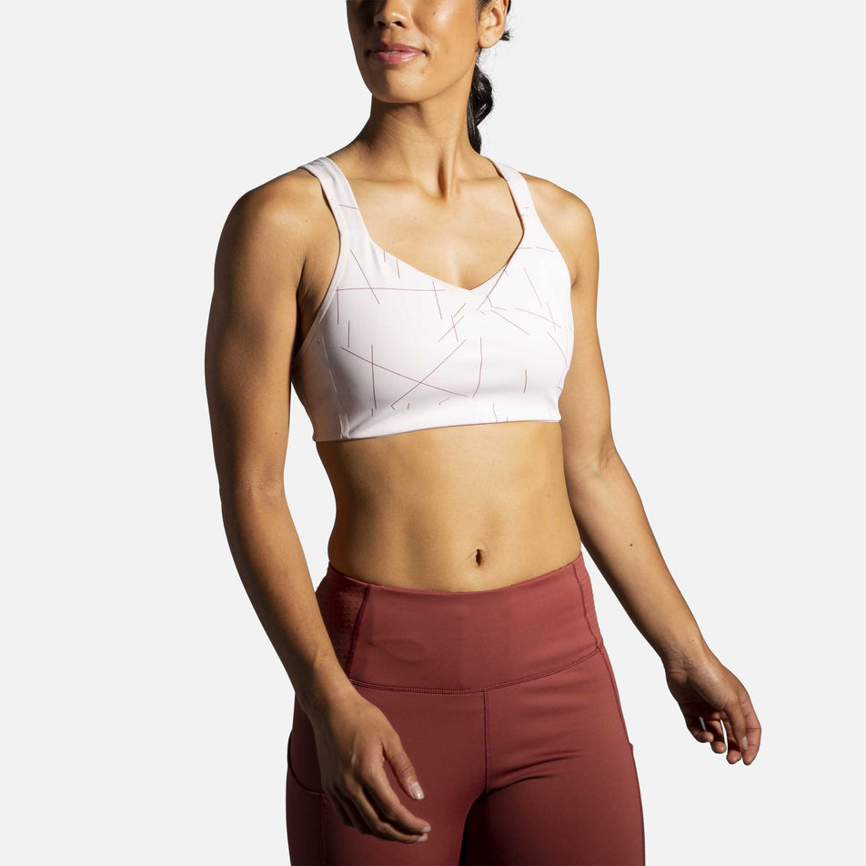 A female model wearing the women's Brooks Drive Convertable Run Bra and tights (6935121887394)