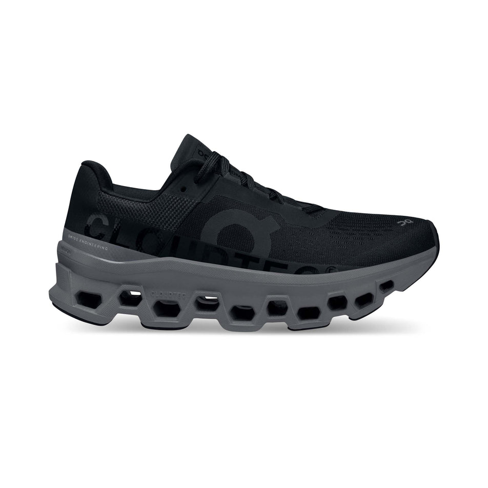 Right shoe lateral view of On Women's Cloudmonster Running Shoes in black (7724309774498)