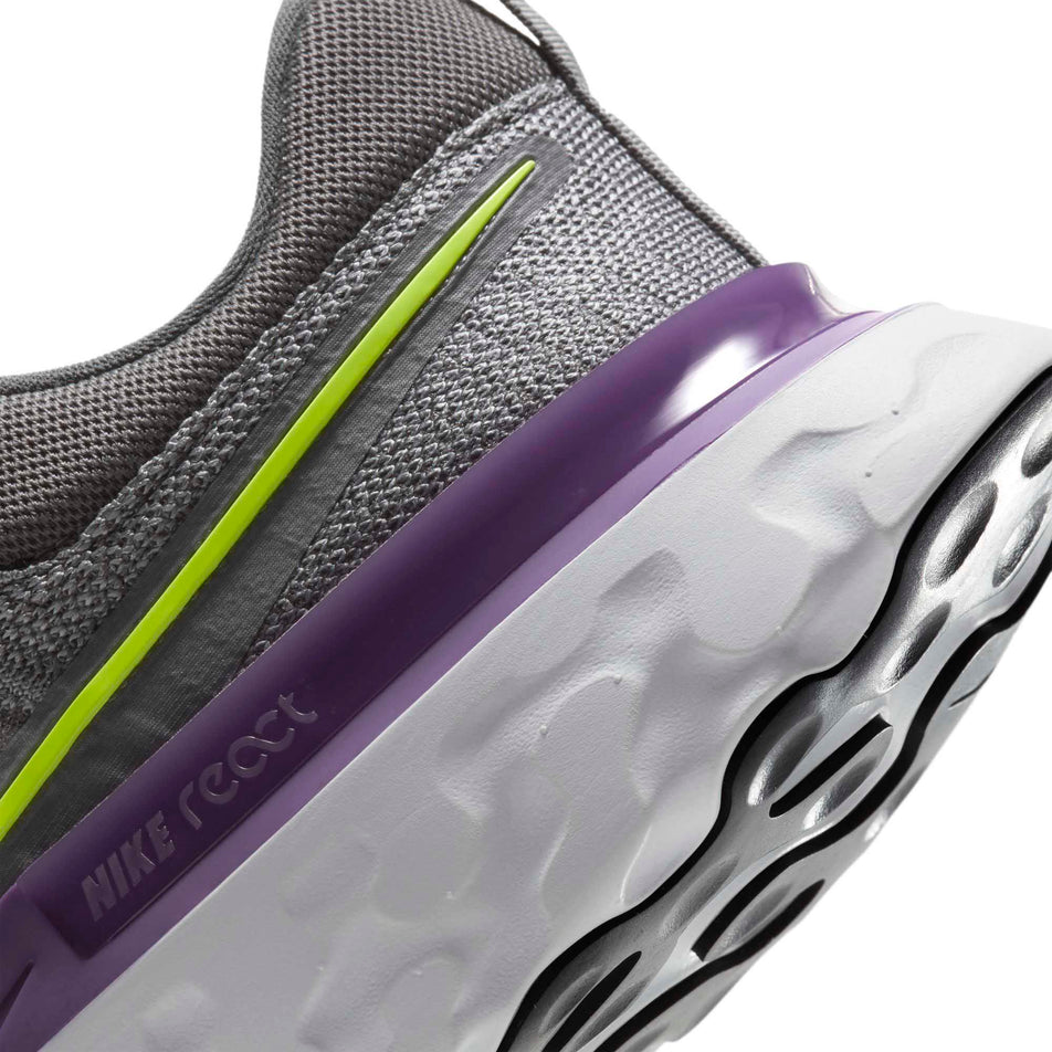 Rear section of the left shoe from a pair of men's Nike React Infinity Run Flyknit 2 with focus on React Foam midsole (6899658719394)