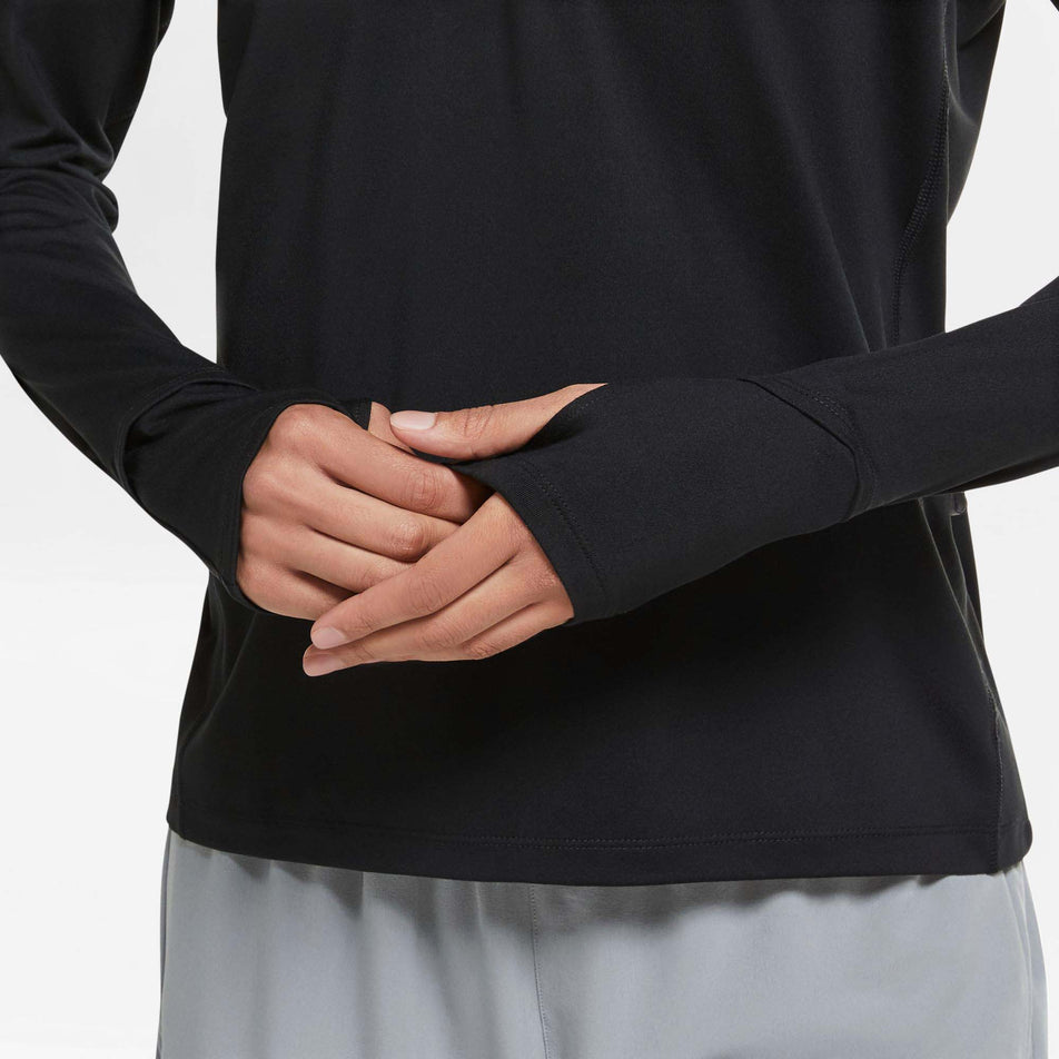Thumb loop cuff view of Nike Women's Dri-Fit Element Running Top HZ in black (7677561864354)