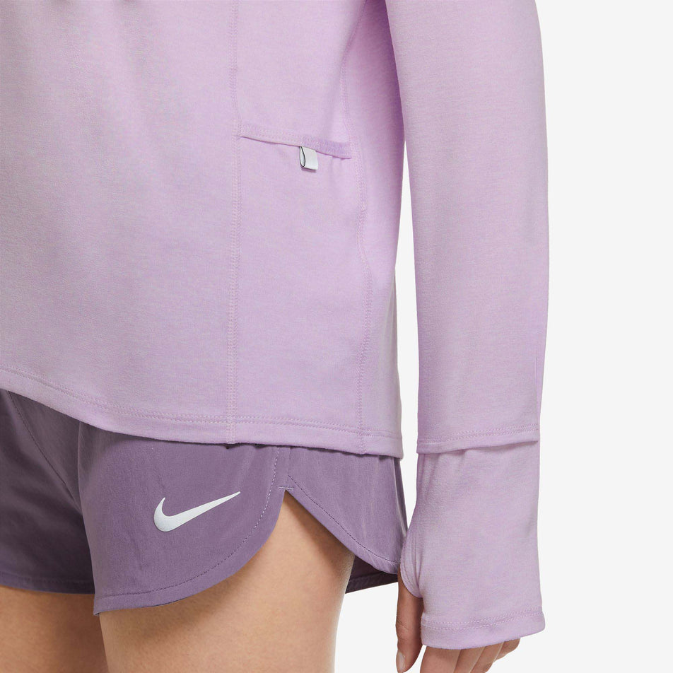 Hemline view of women's nike dri-fit element top hz in pink (7518127653026)