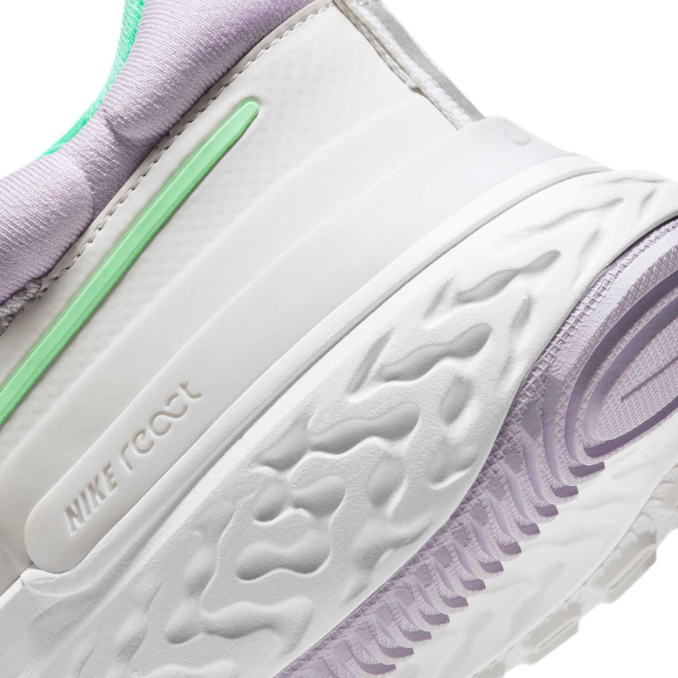 Rear section of the left shoe from a pair of women's Nike React Miler 2 with focus on the React Foam cushioning in the heel (6899776454818)