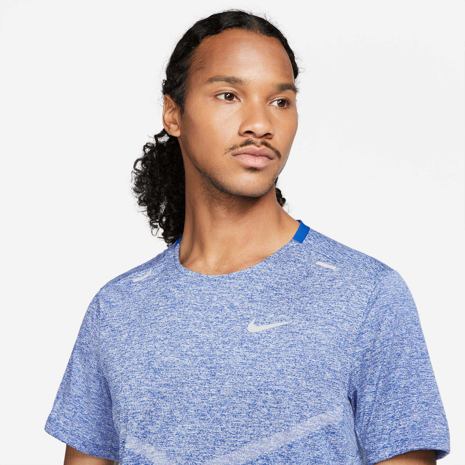 Front view of a model wearing a Nike Men's Dri-FIT Rise 365 Short-Sleeve Running Top - close-up of the chest section (7876684316834)