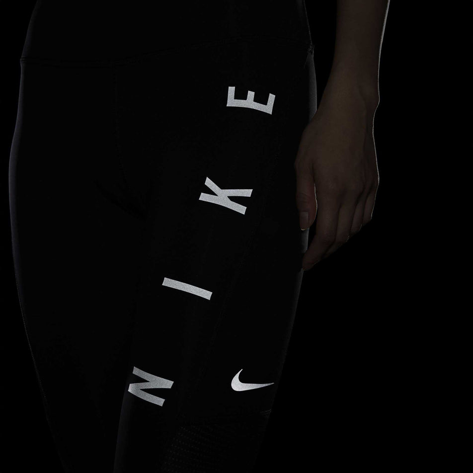The reflective detailing on the left leg of a women's Nike Run Division Epic Fast Tight GX (6936939724962)