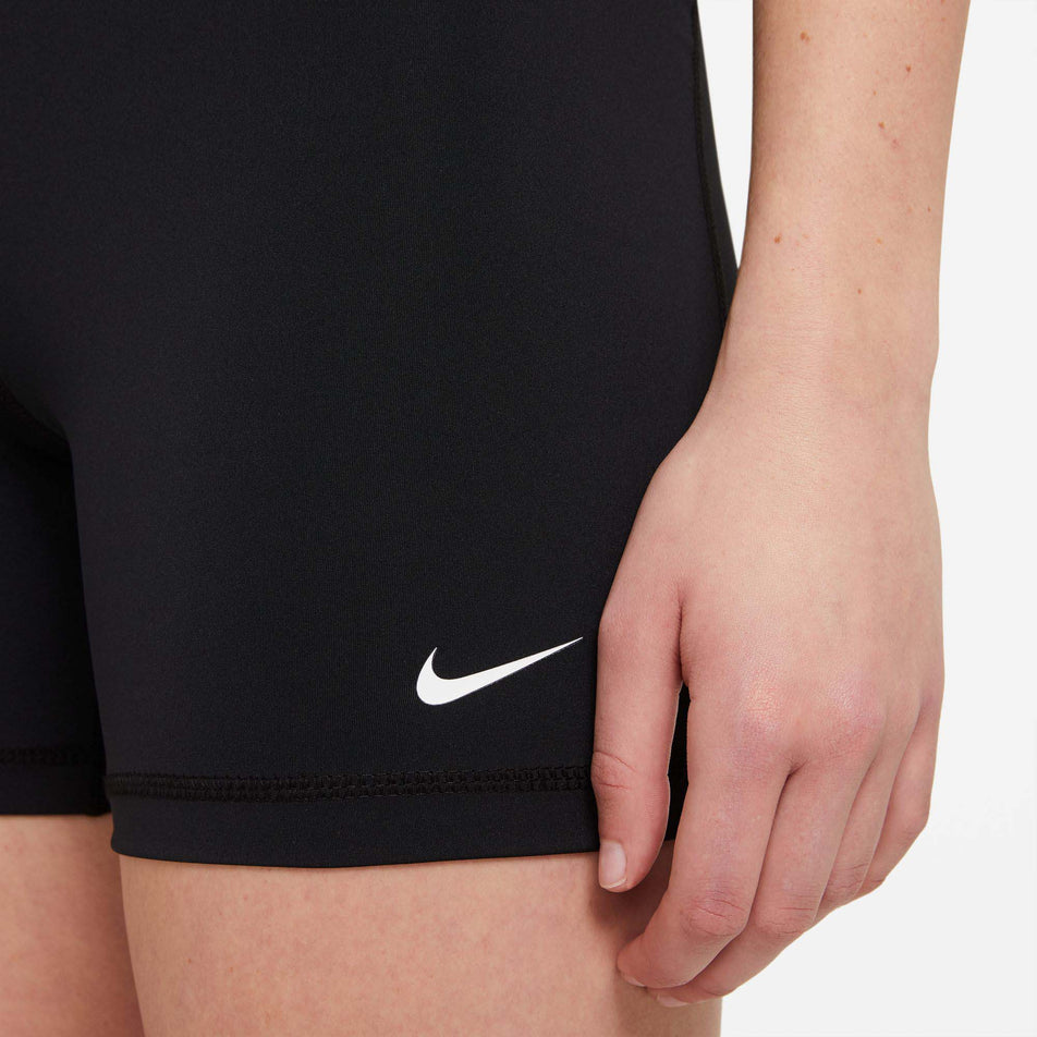 Logo view of Nike Women's NP 365 Short 5 Inch in black. (7729545478306)