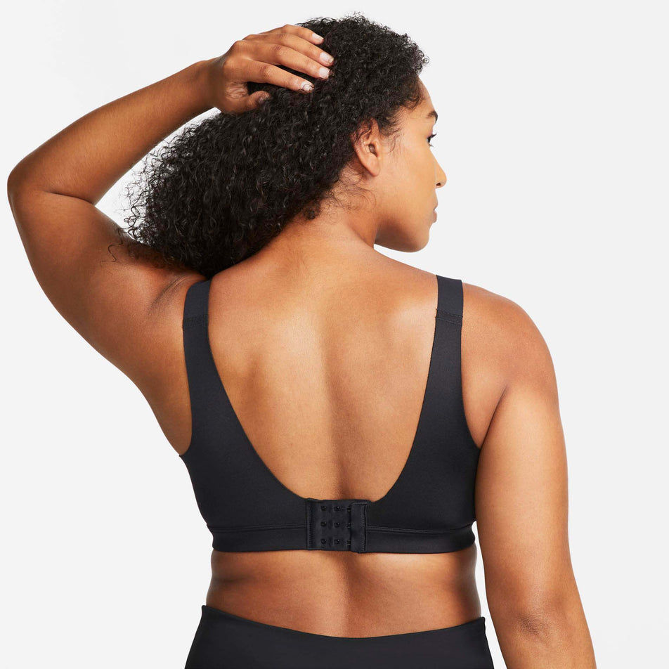 Behind view of women's nike dri-fit alpha bra in black (7577920635042)