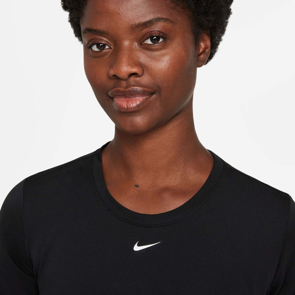 Neckline view of Nike Women's ONE STD Top in black (7677526737058)