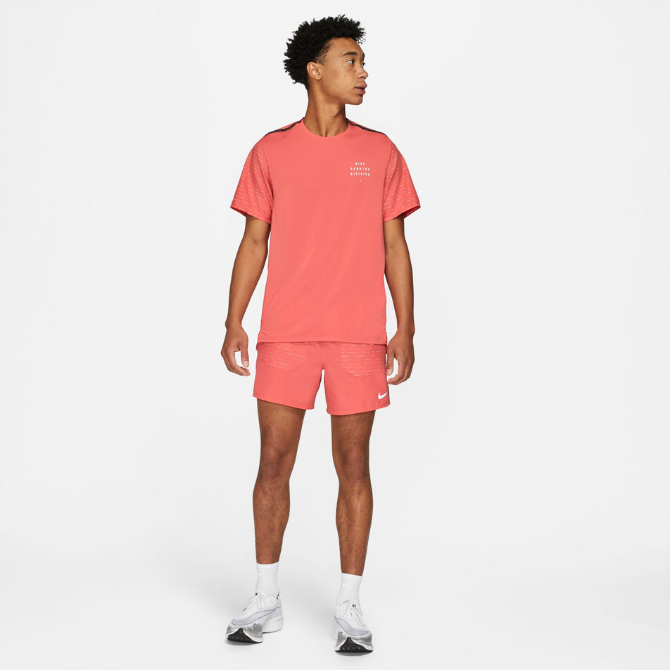 Model wears  Nike Dri-Fit Run Division NV Rise 365 SS top (6917935399074)