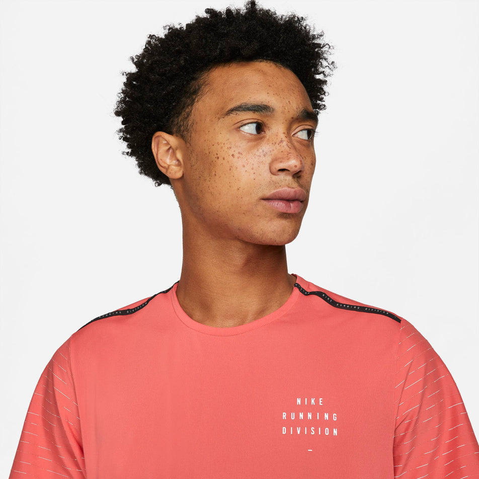 Logo detail on front of  Nike Dri-Fit Run Division NV Rise 365 SS top (6917935399074)
