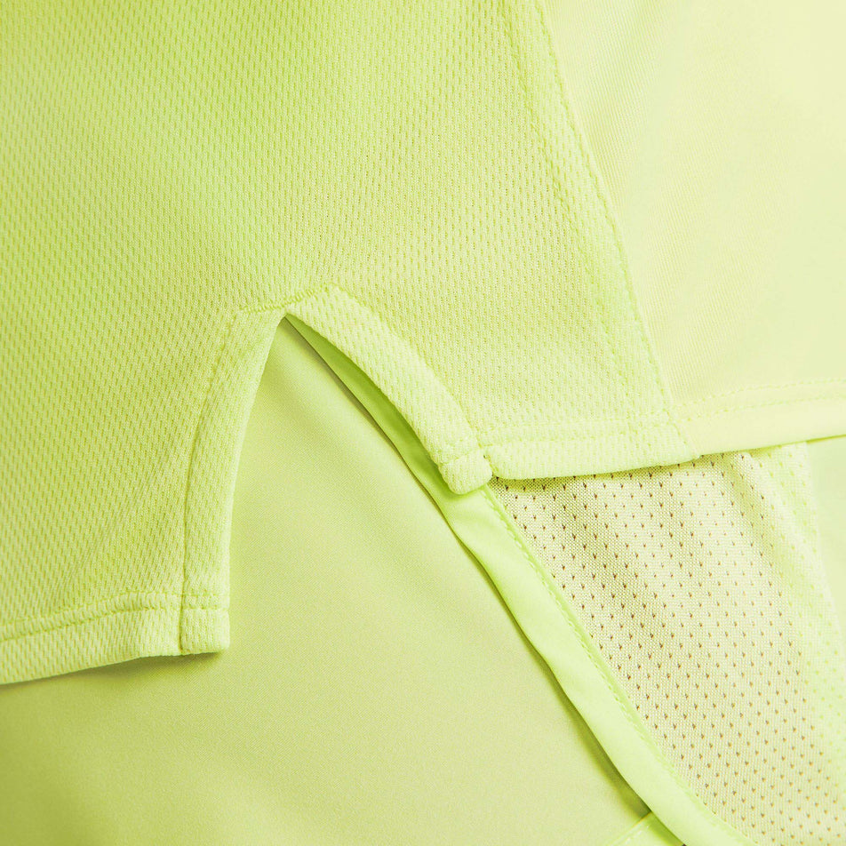 Hemline view of Nike Women's DF Race Top SS in green. (7773288890530)