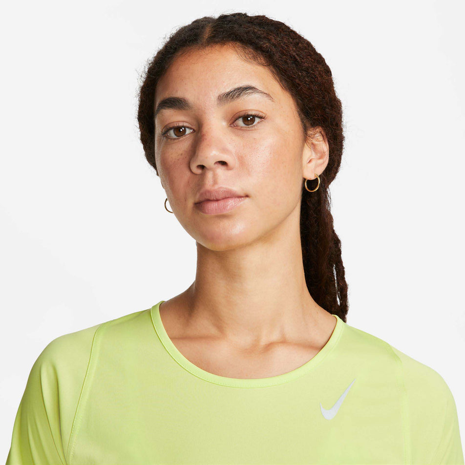 Neckline view of Nike Women's DF Race Top SS in green. (7773288890530)