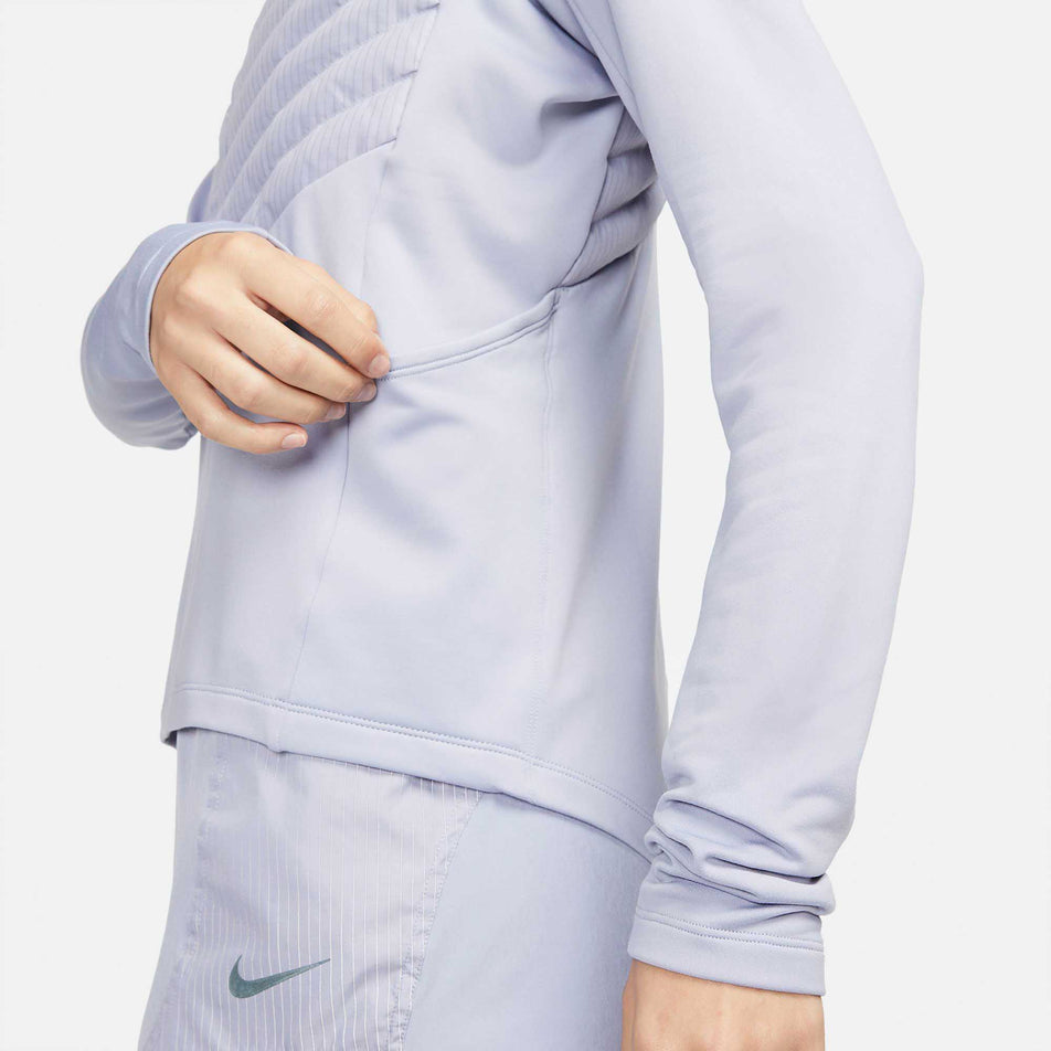 Side pouch pocket view of women's nike tf run division hybrid jacket (6918124863650)