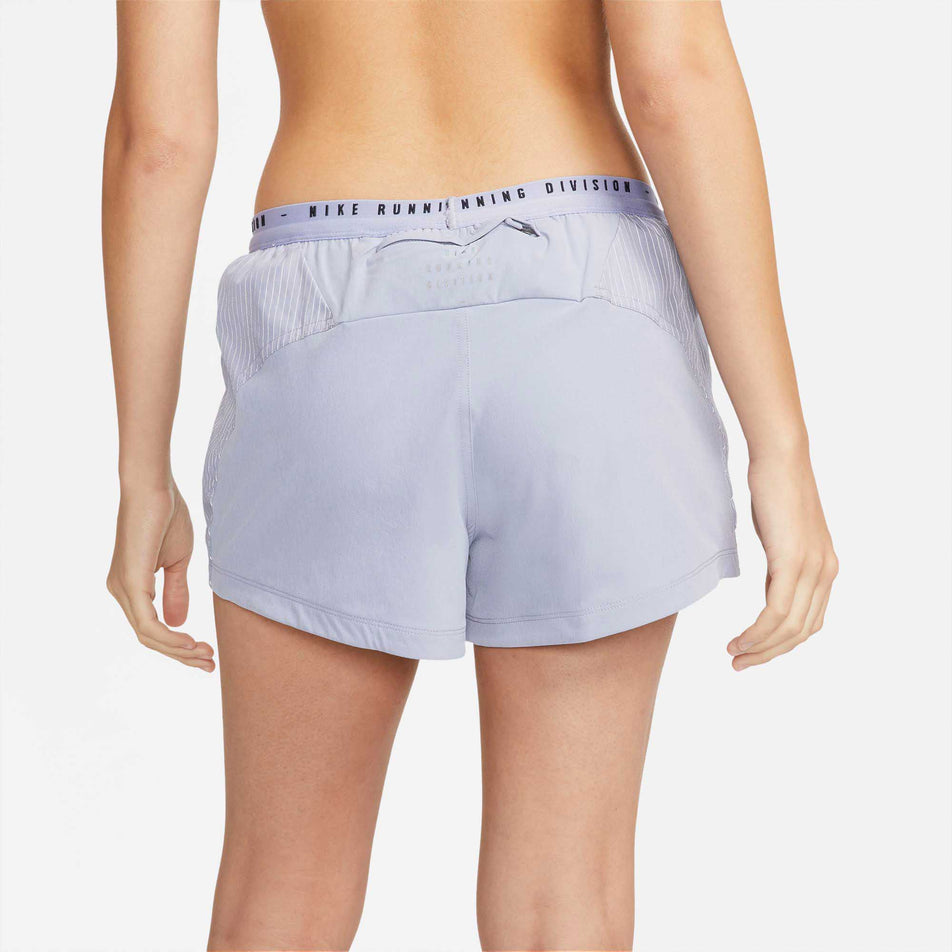 Behind view of women's nike run division tempo lx short (6918129254562)