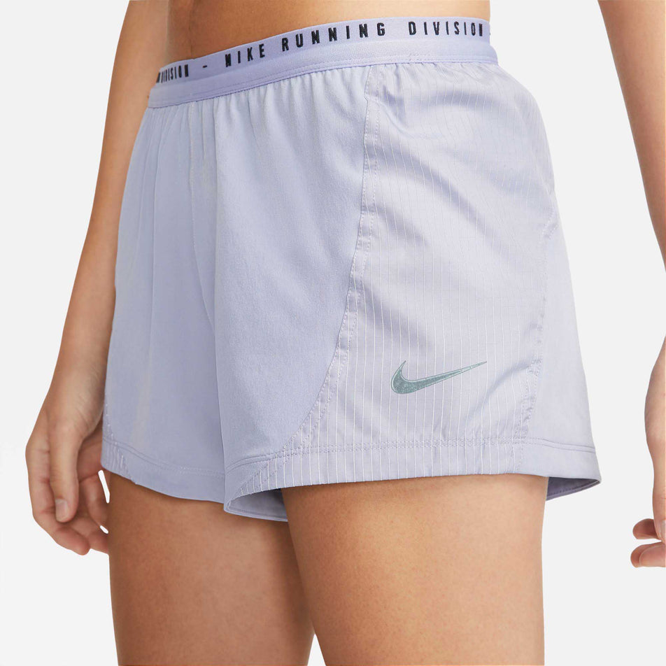Side logo view of women's nike run division tempo lx short (6918129254562)