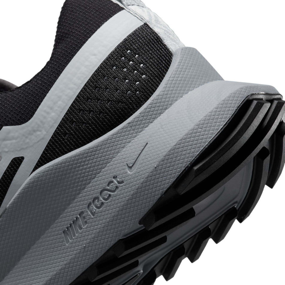 Right shoe midsole view of Nike Women's React Pegasus Trail 4 Running Shoes in black. (7728658645154)