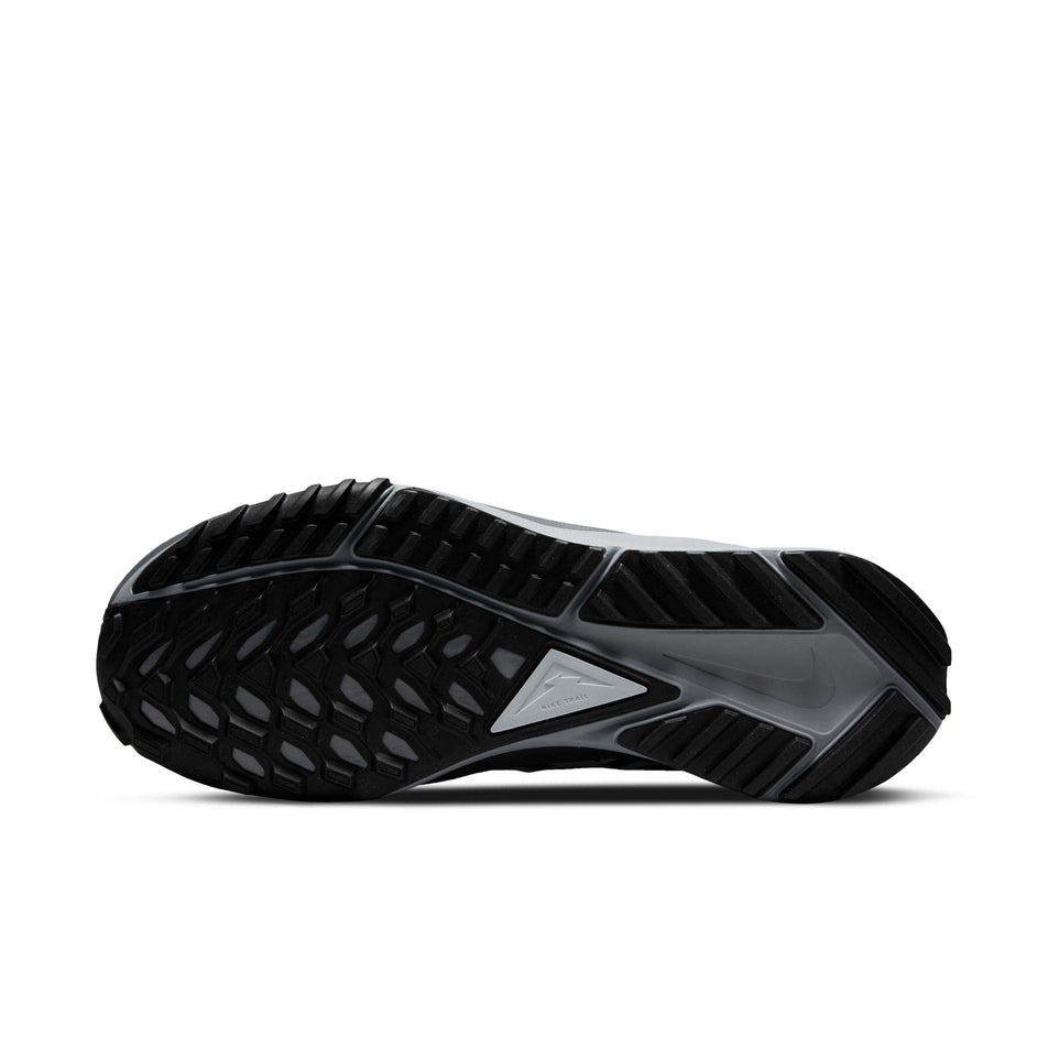 Right shoe outsole view of Nike Women's React Pegasus Trail 4 Running Shoes in black. (7728658645154)
