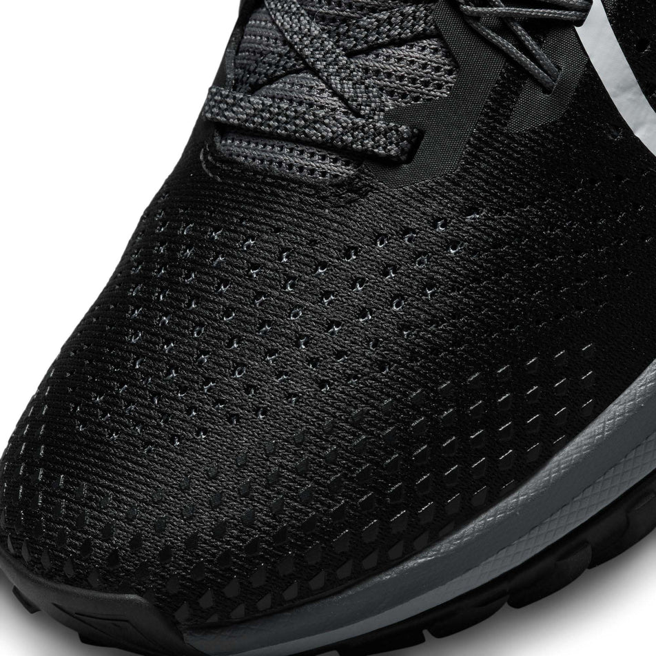 Left shoe toebox view of Nike Women's React Pegasus Trail 4 Running Shoes in black. (7728658645154)