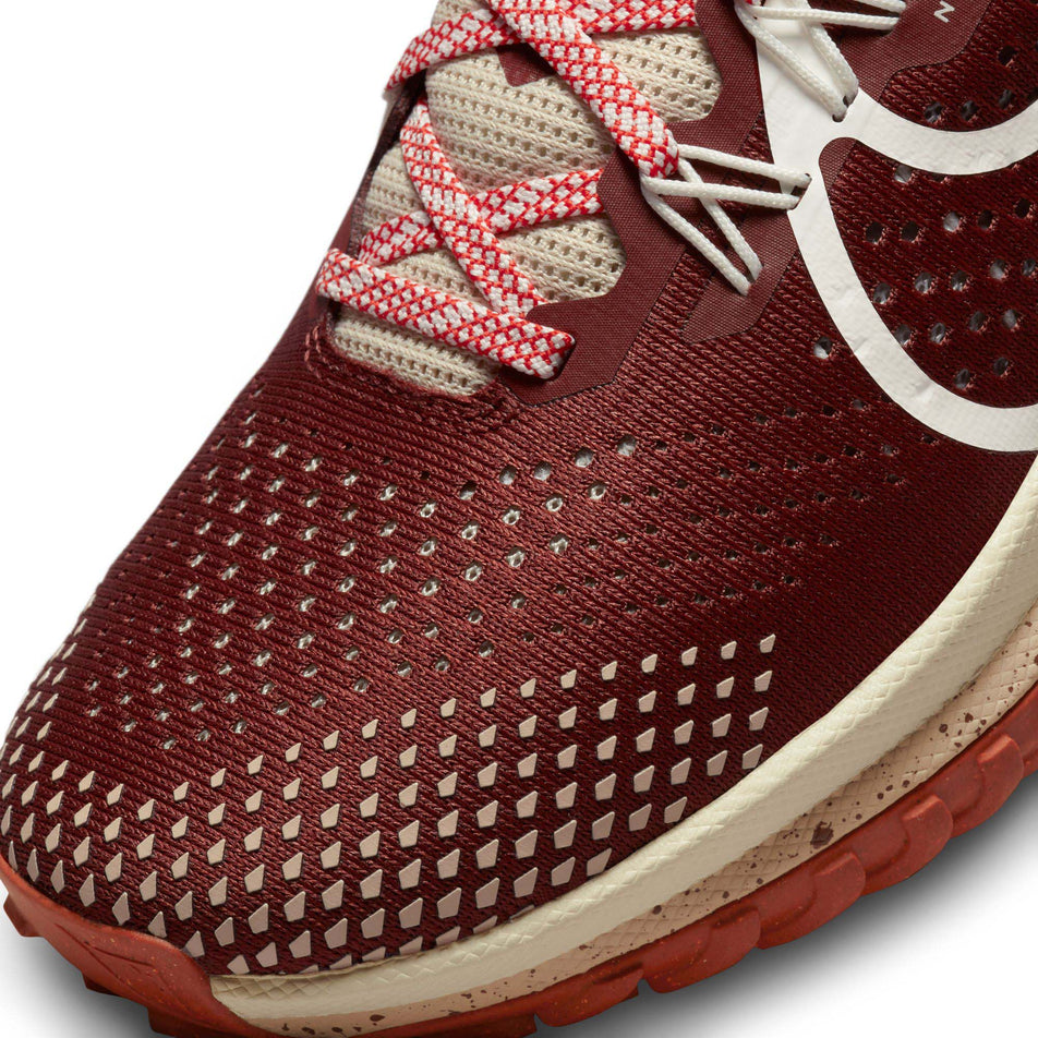 The toe box on the left shoe from a pair of Nike Women's Pegasus Trail 4 Running Shoes (7875537240226)