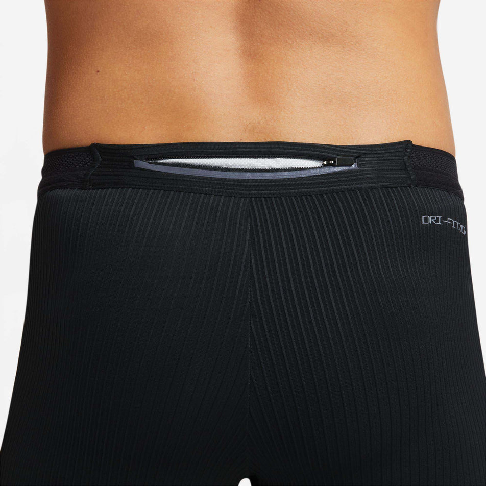 The outer zipped pocket on the waistband of a pair of Nike Men's Dri-FIT ADV AeroSwift 1/2-Length Racing Tights (7876595712162)
