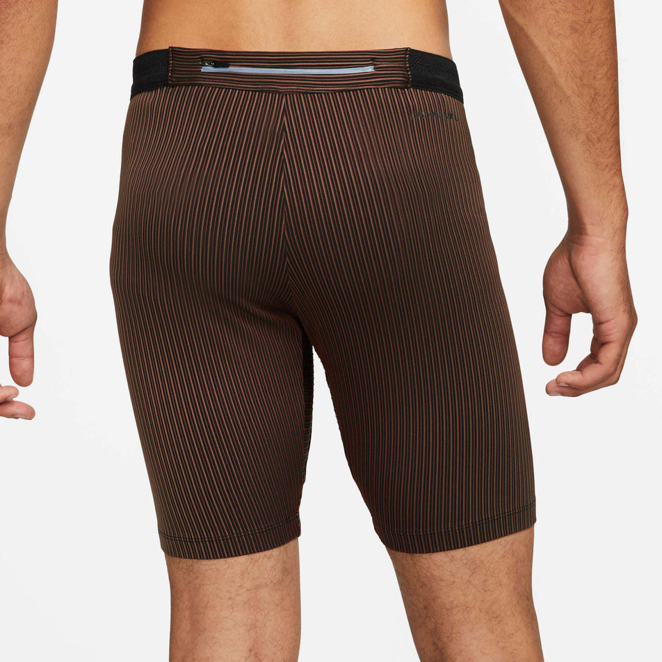 Rear view of men's Nike Aeroswift Half Tights in brown (7492237263010)