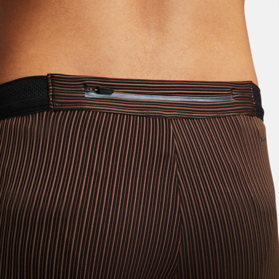 Zip pocket view of men's Nike Aeroswift Half Tights in brown (7492237263010)