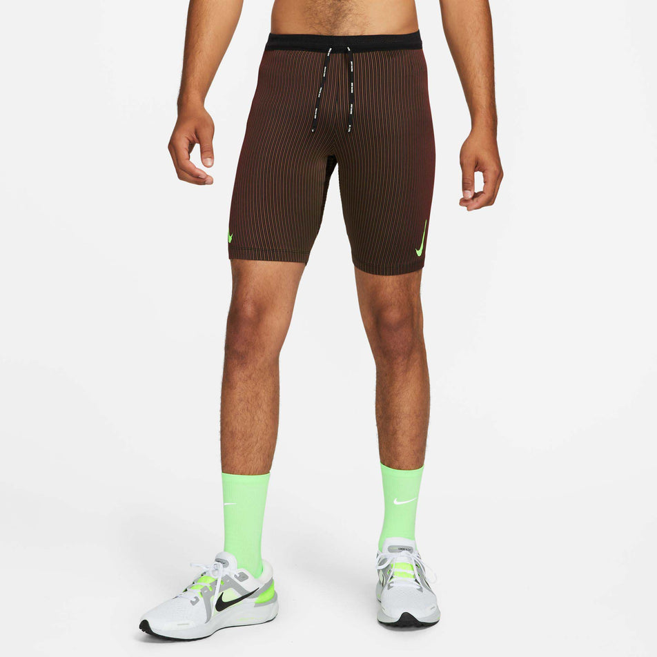 Front model view of men's Nike Aeroswift Half Tights in brown (7492237263010)