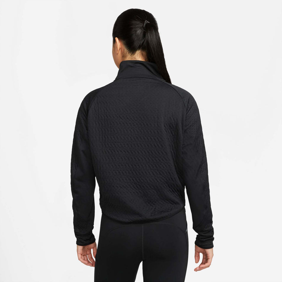 Behind view of women's nike tf run division midlayer (7328903954594)