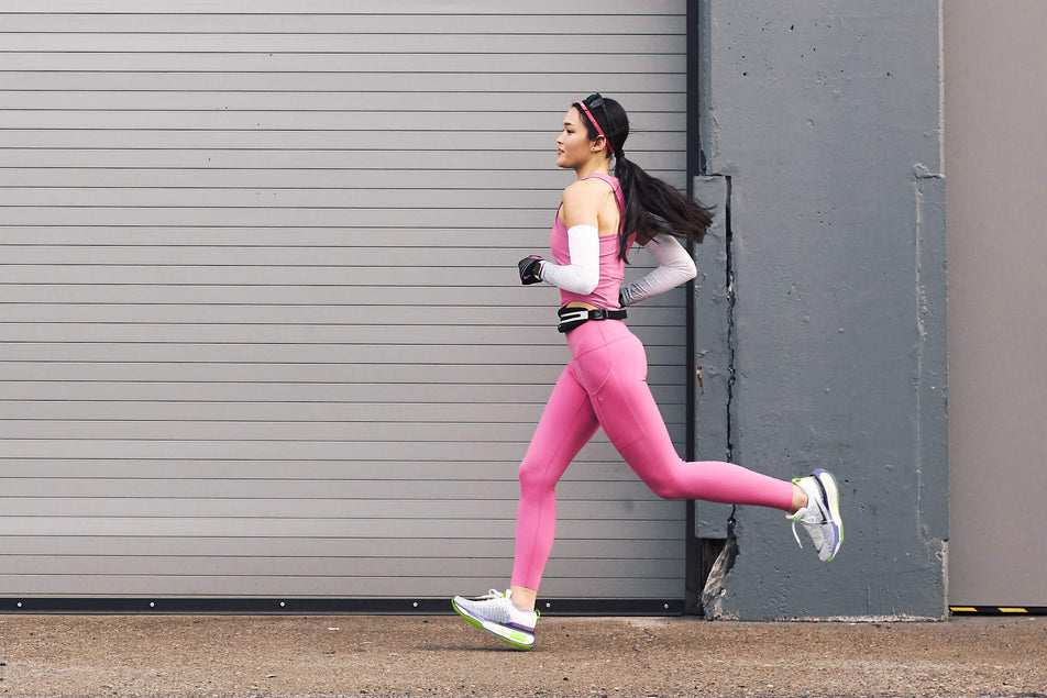 A runner running in a pair of Women's ZoomX Invincible Run Flyknit 3 Running Shoes (7751503282338)