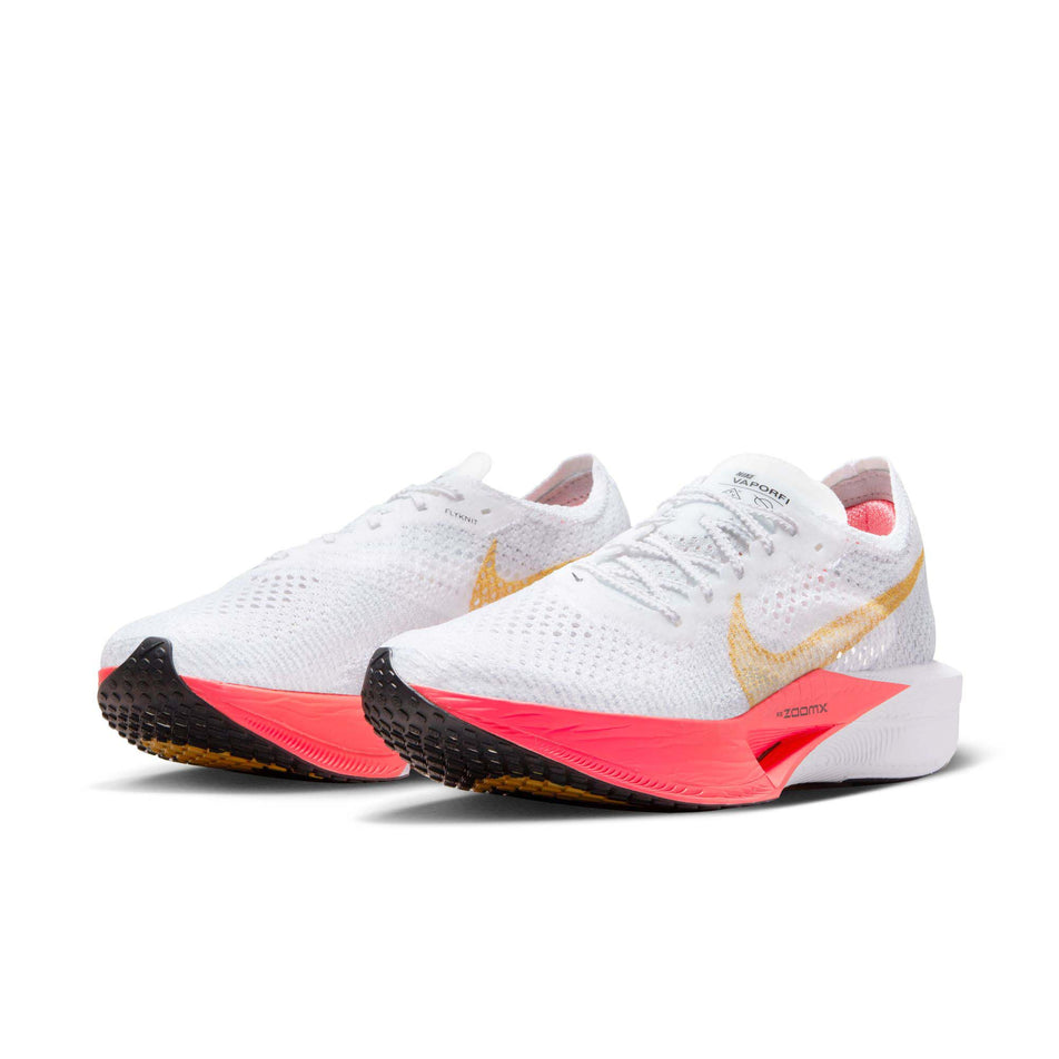 A pair of Nike Women's Vaporfly 3 Road Racing Shoes in the White/Topaz Gold-Sea Coral-Pure Platinum colourway (7867372372130)