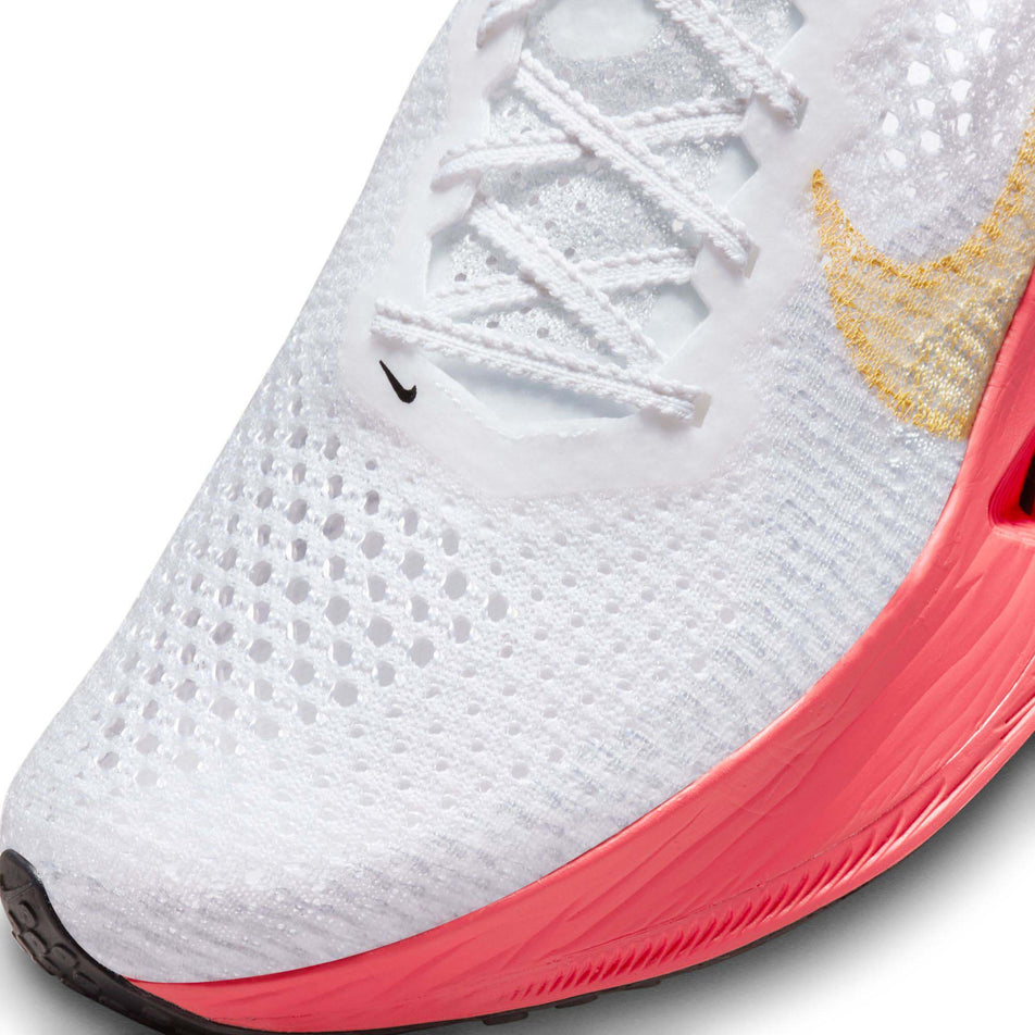 Close-up of the toe box on the left shoe from a pair of Nike Women's Vaporfly 3 Road Racing Shoes in the White/Topaz Gold-Sea Coral-Pure Platinum colourway (7867372372130)