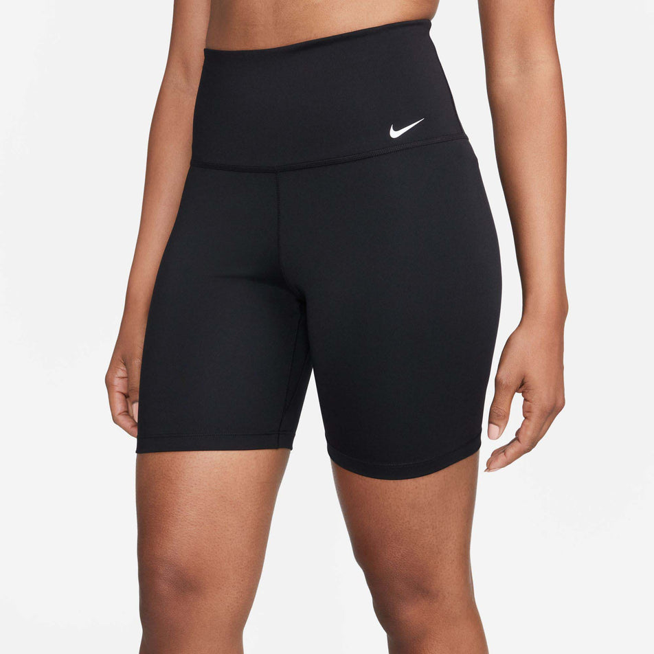 Front view of a model wearing a pair of women's Nike Dri-FIT One High-Waisted 7 Inch Biker Shorts (7749194416290)