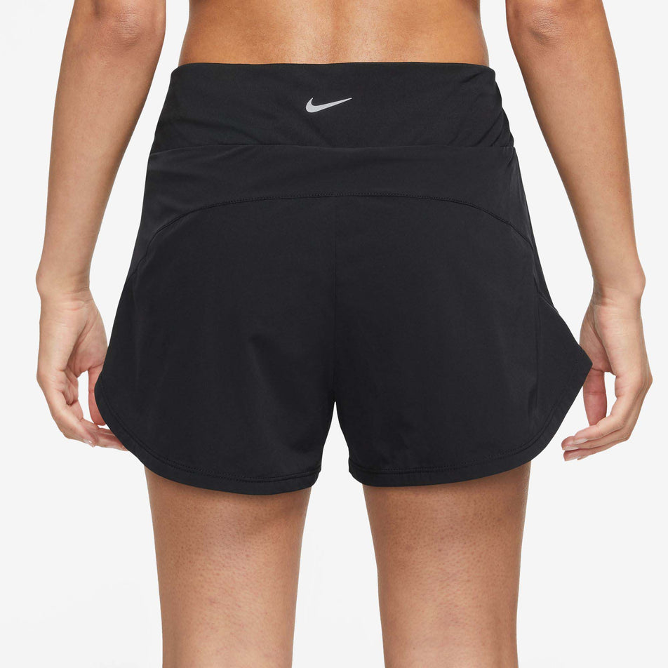 Rear view of Nike Women's Bliss DF MR 3 Inch 2in1 Running Short in black. (7761806360738)