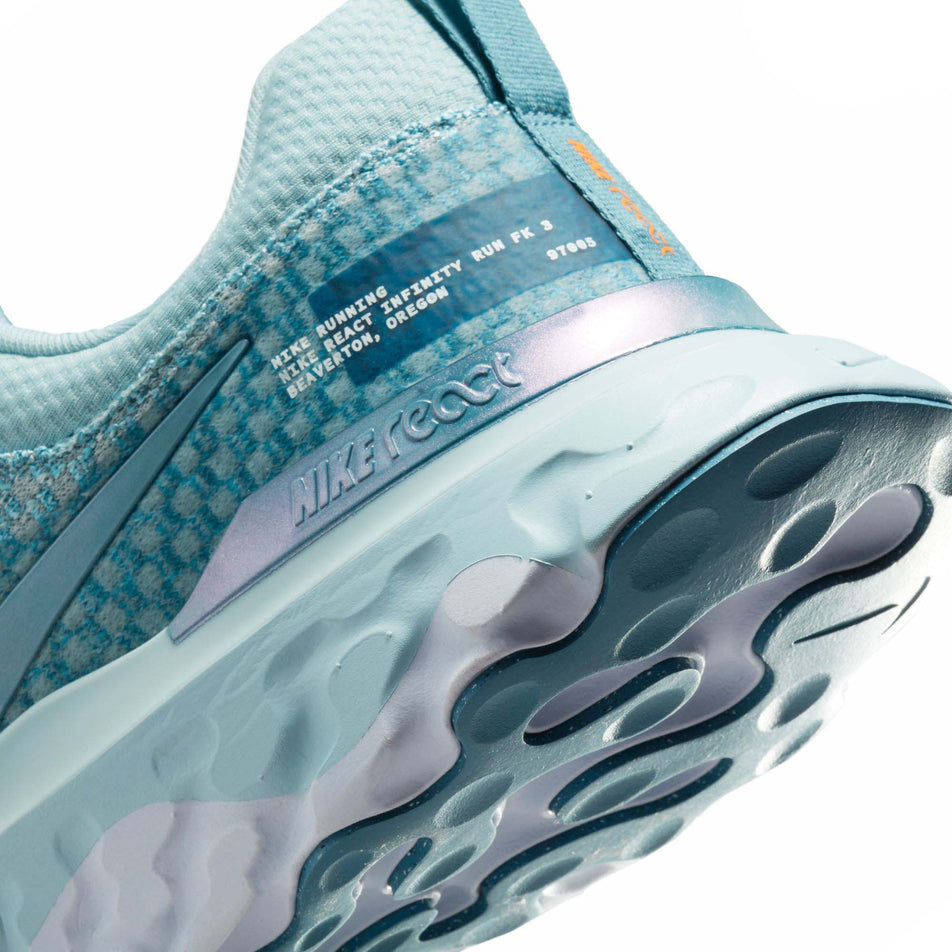 The lateral side of the heel counter on the left shoe from a pair of men's Nike React Infinity Run Flyknit 3 Running Shoes (7751474249890)