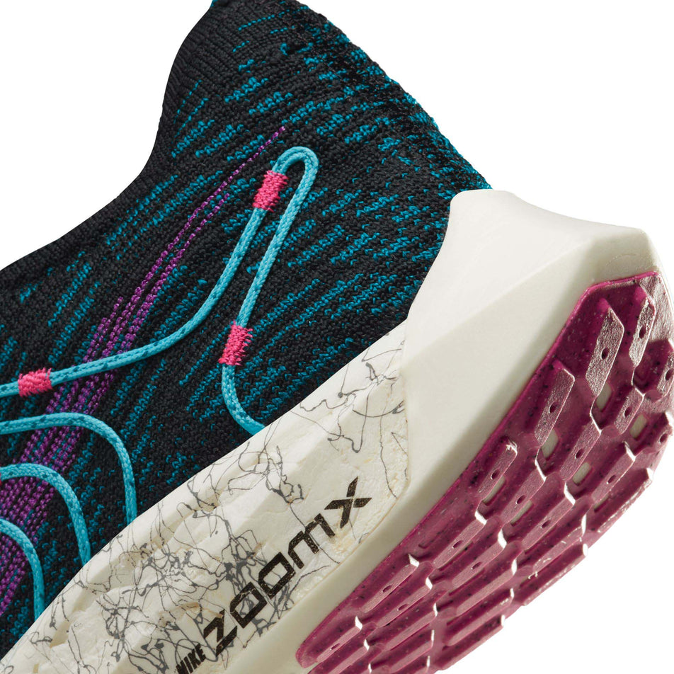 Lateral side of the heel counter on the left shoe from a pair of Nike Women's Pegasus Turbo Next Nature SE Road Running Shoes (7867341045922)
