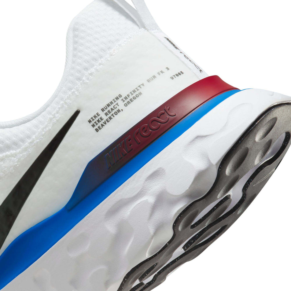 The heel counter on the left shoe from a pair of Nike Men's React Infinity Run Flyknit 3 Road Running Shoes (7864313315490)
