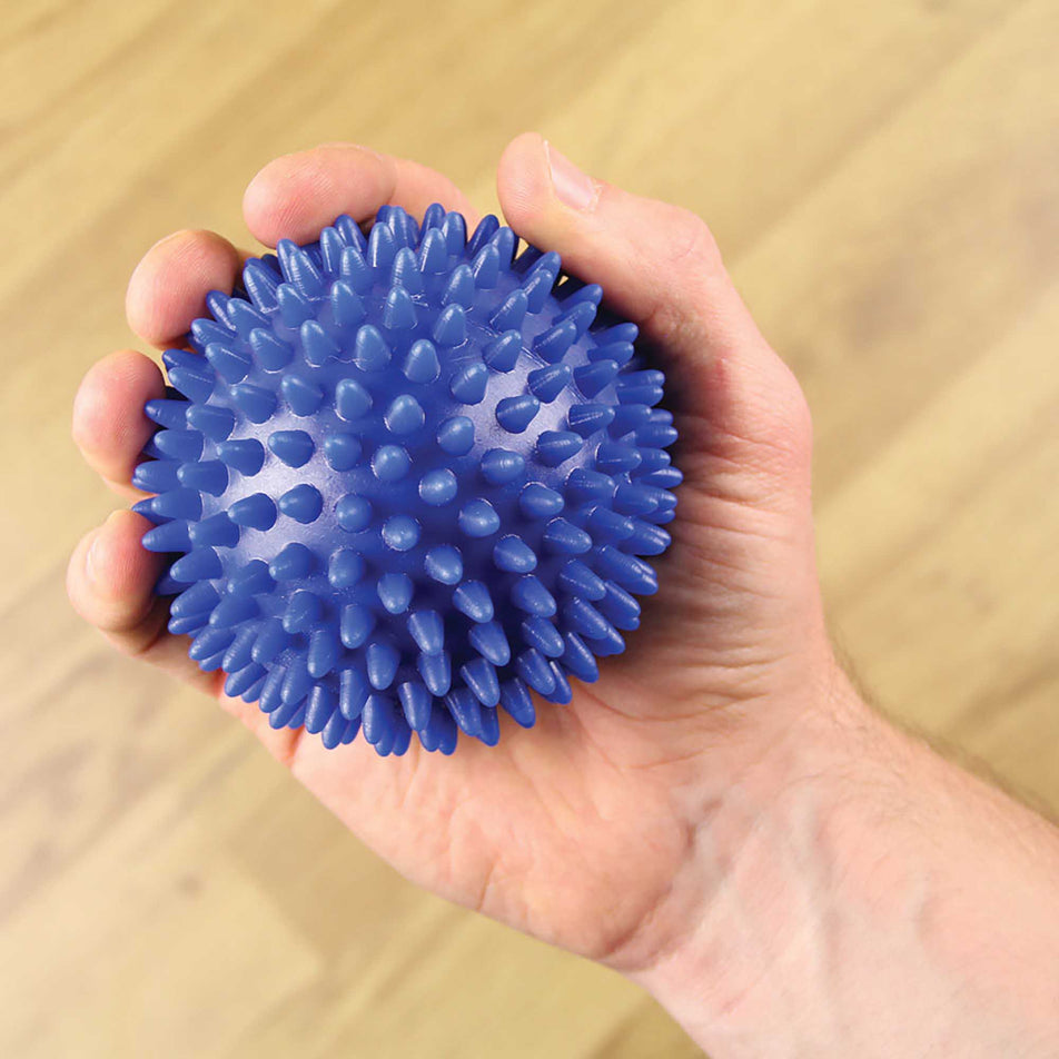 Held view of unisex fitness-mad spiky massage ball (7076991860898)
