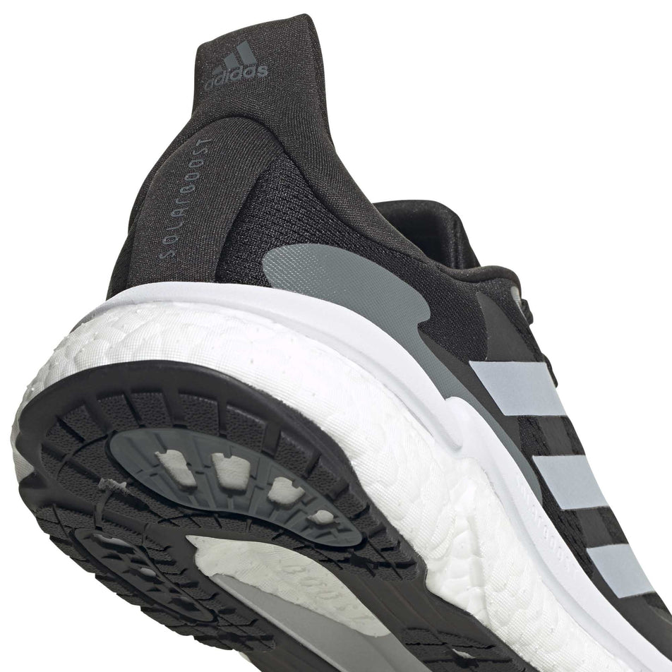 The heel unit on the right shoe from a pair of men's adidas Solar Boost 3  (6893369131170)