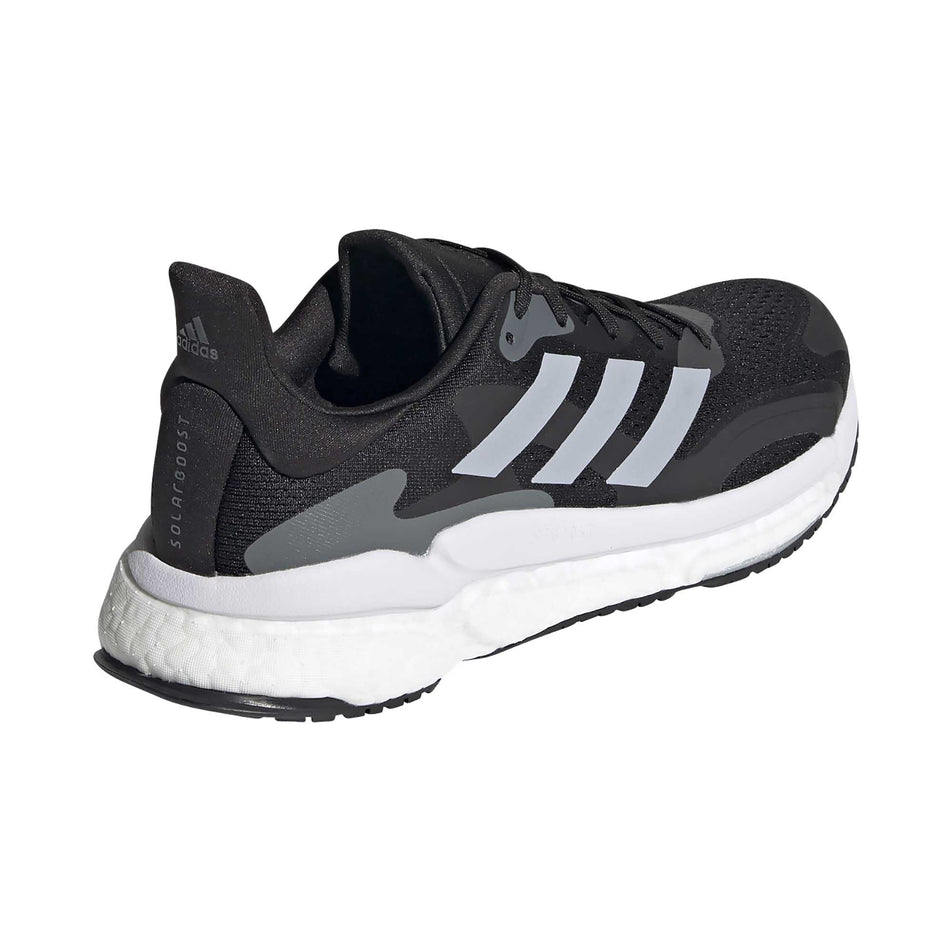 The right shoe from a pair of women's adidas Solar Boost 3 (6893723287714)